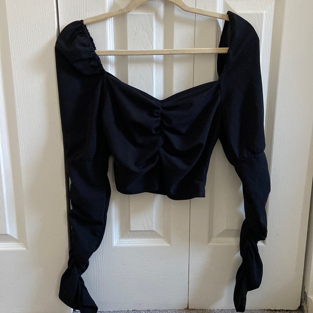 Black long sleeve crop top with slightly puffed shoulders. Size medium